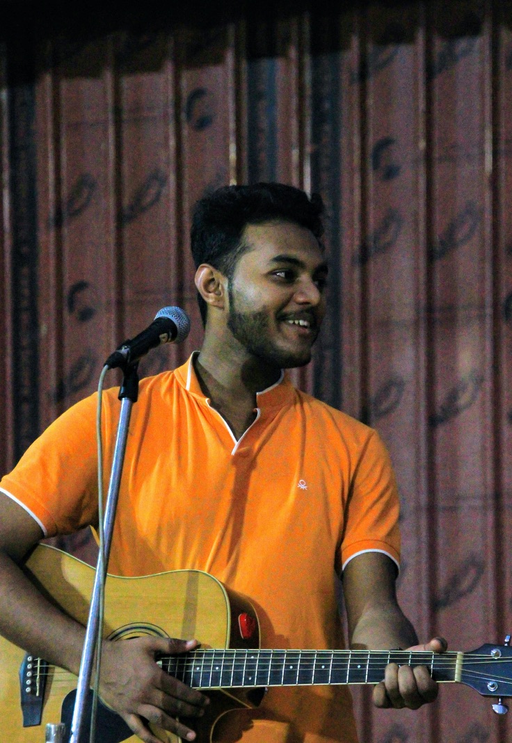 Aayush performing guitar